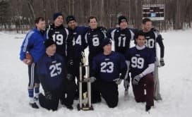 The Ridgewood Frost posing with the championship trophy in the snow